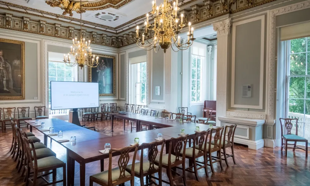 table laid out in u-shape in a grand room