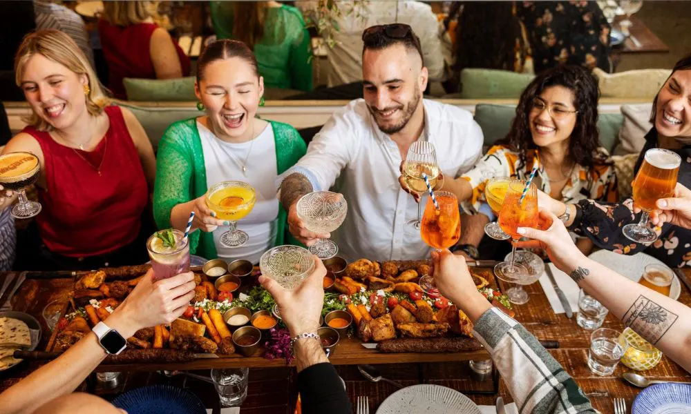 group dinner with sharing boards and cocktails