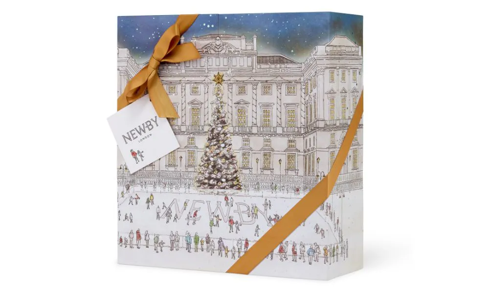 dainty ice skating sketch on box with gold ribbon