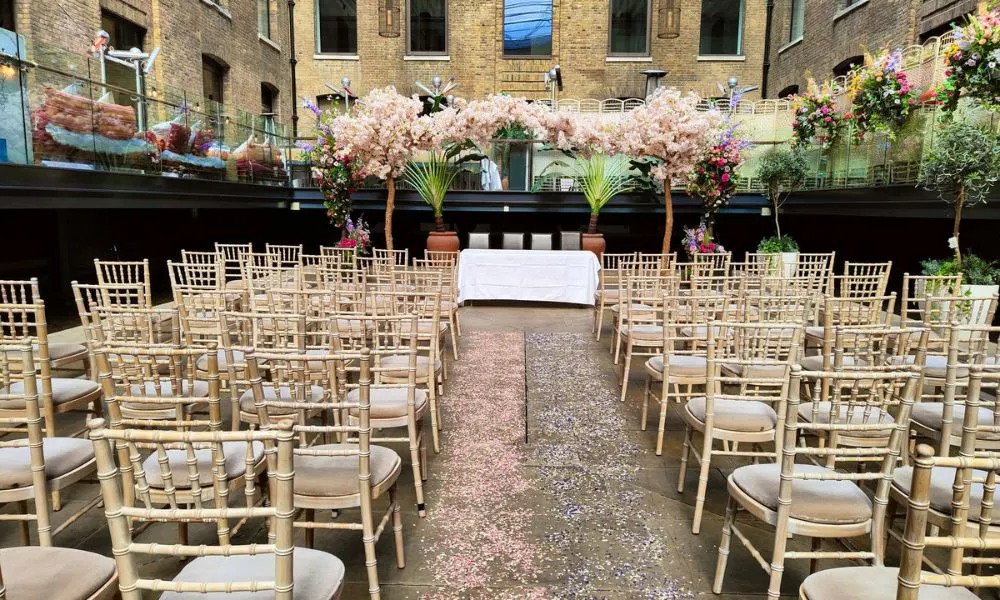 alfresco courtyard with wedding ceremony set up
