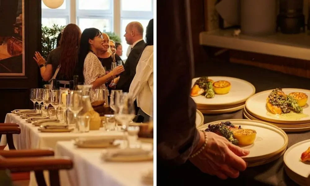 long banquet table and plates of broccoli being served from kitchen