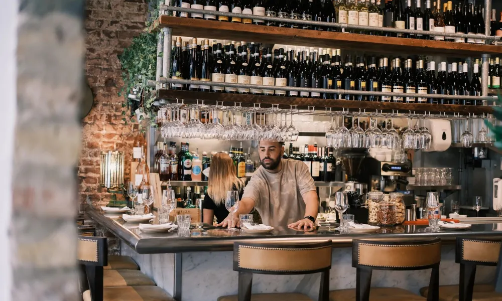 Wine bar bar with rows of bottles and glasses