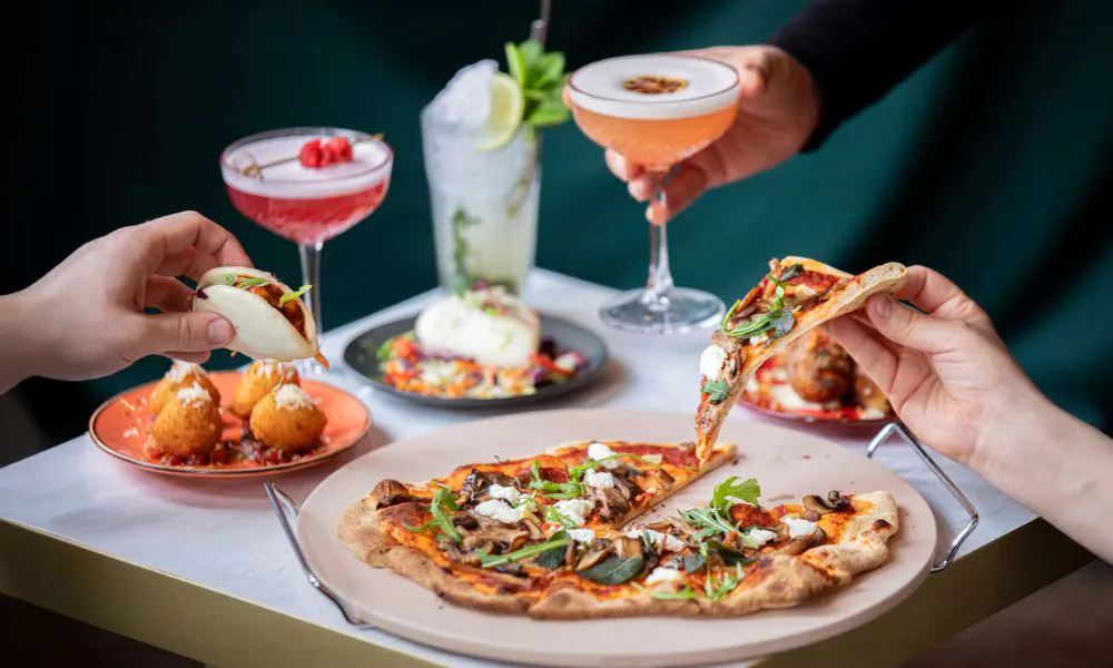 pizzas and cocktails on a table