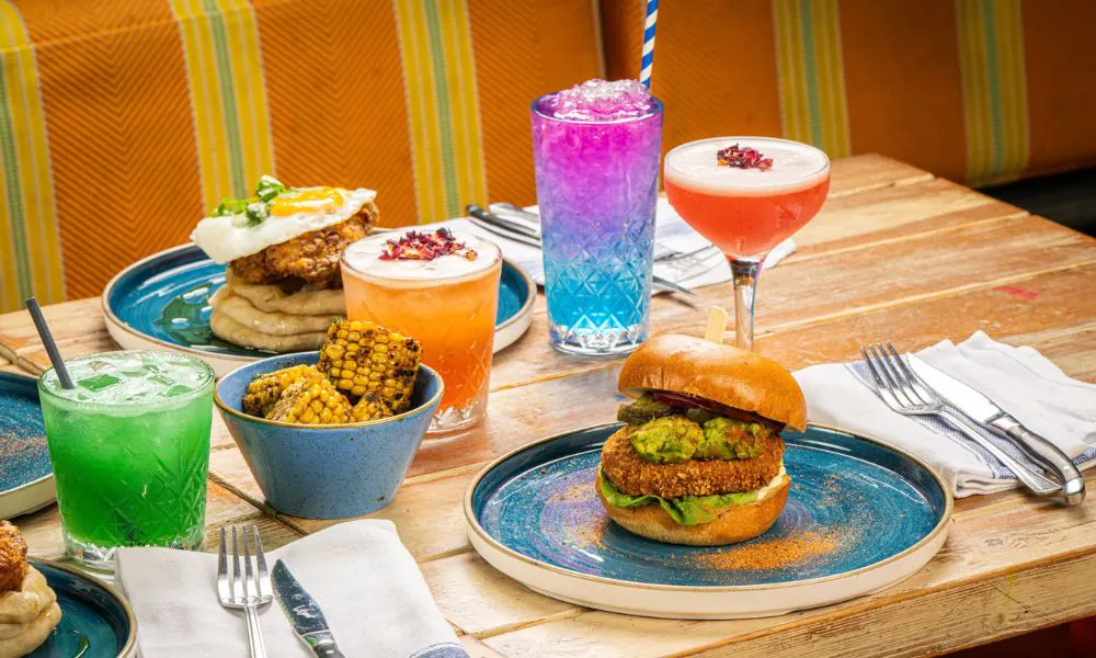 a selection of brunch dishes and cocktails on a table 