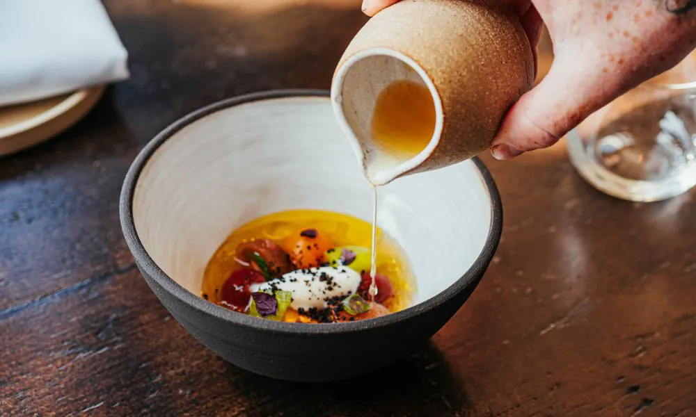 Pouring sauce over a dish