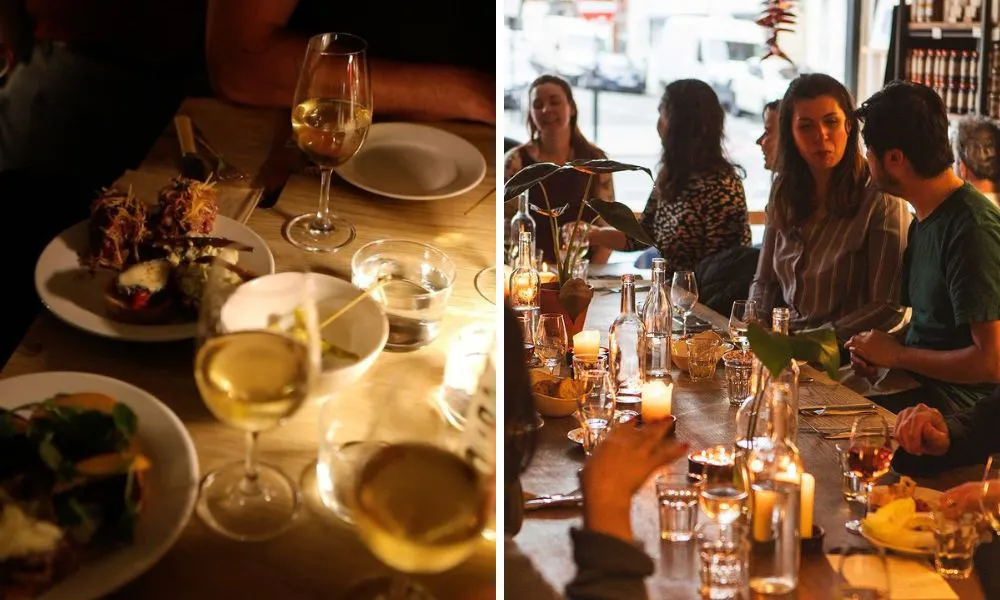 dimly lit restaurant with small plates and wine