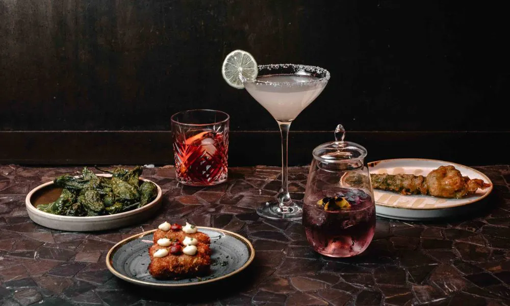 Plates of food and cocktails
