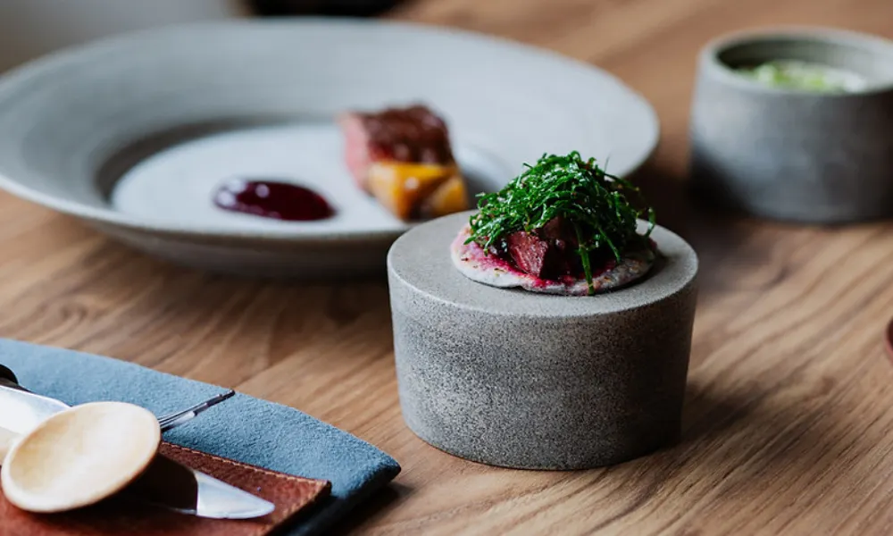 concrete cylinder with beetroot wrap