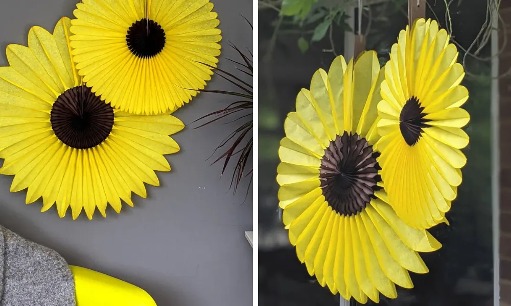 paper hanging fans shaped like yellow sunflowers