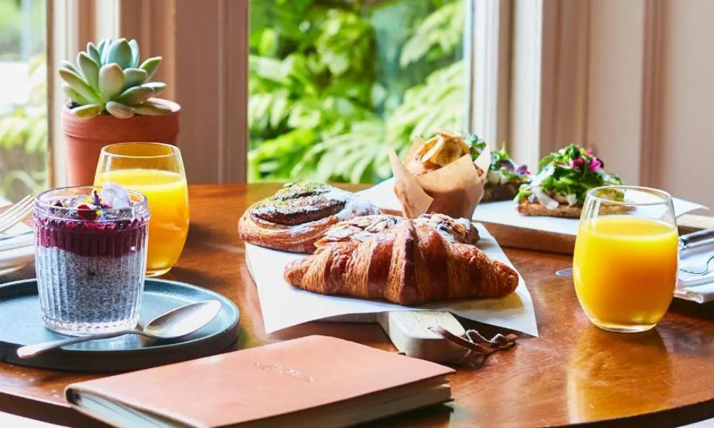 pastries, juices and brunch dishes on a table