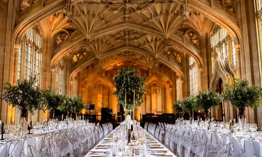 banquet tables set beneath ornate vaulted ceiling