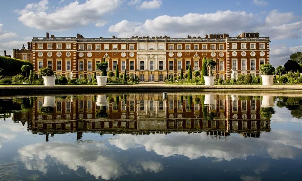 hampton court manor reflected in the lake