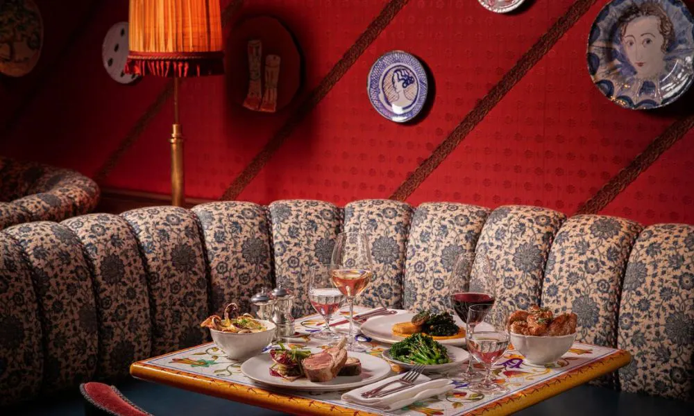 Restaurant table with patterned booth and italian food