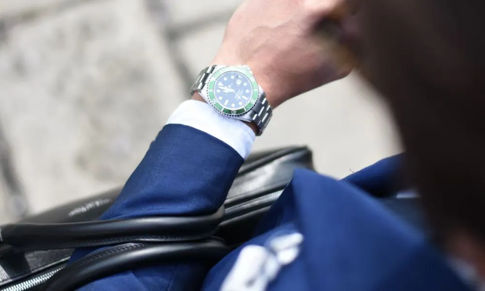 man looking at watch