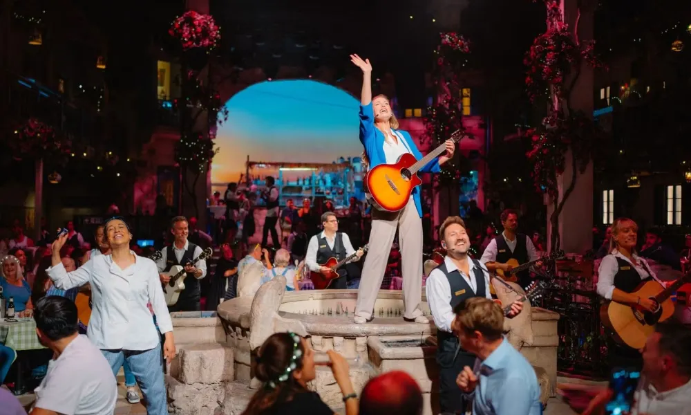mamma mia actors with a guitar 
