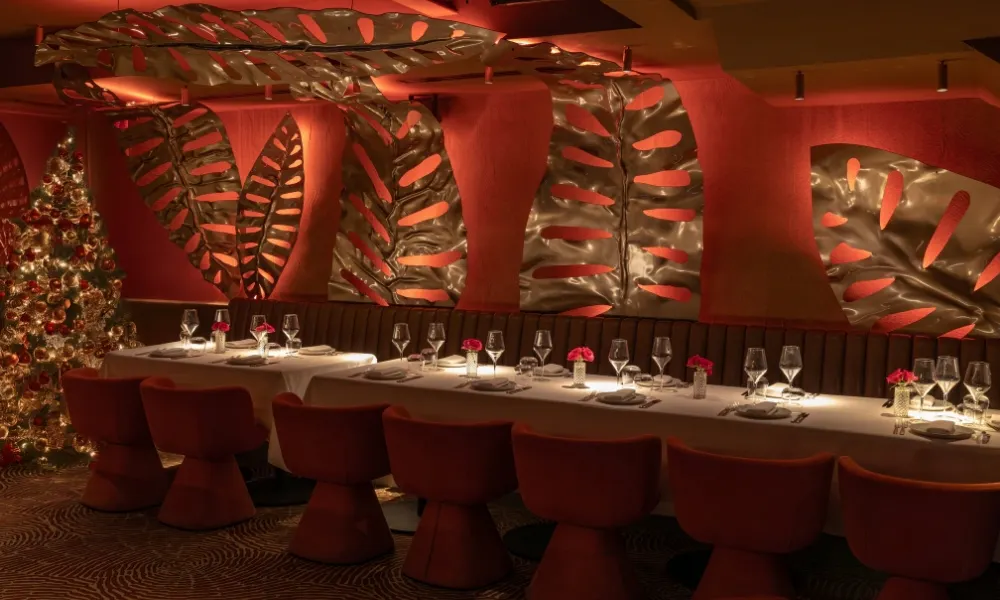 red private diing room with gold leaves and tree