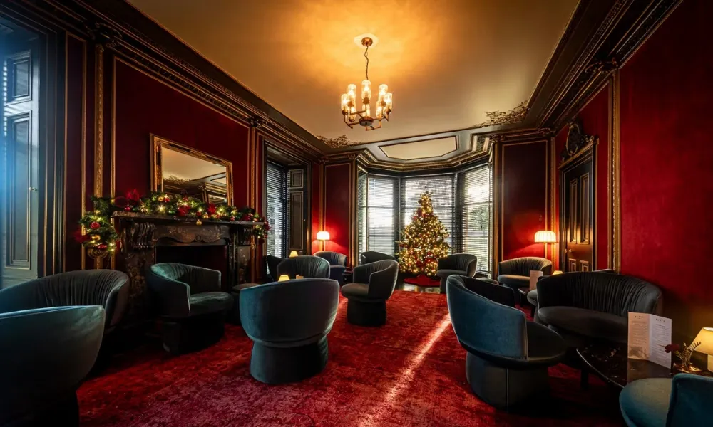 velvet room with lounge seating and christmas styling