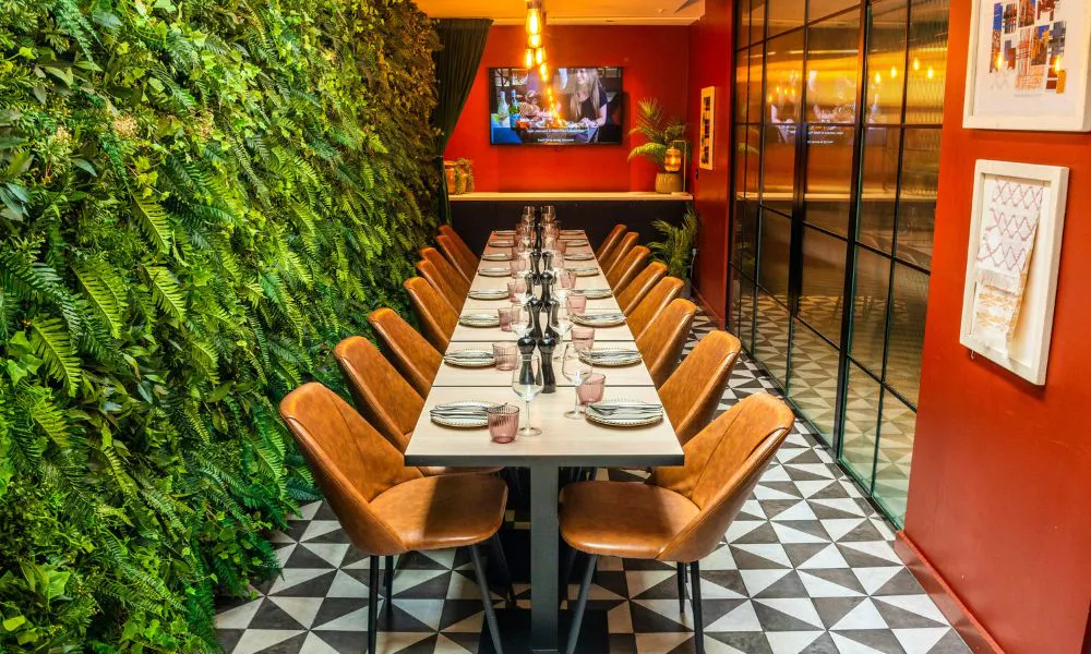 the foliage-filled dining room at Sotto Cucina