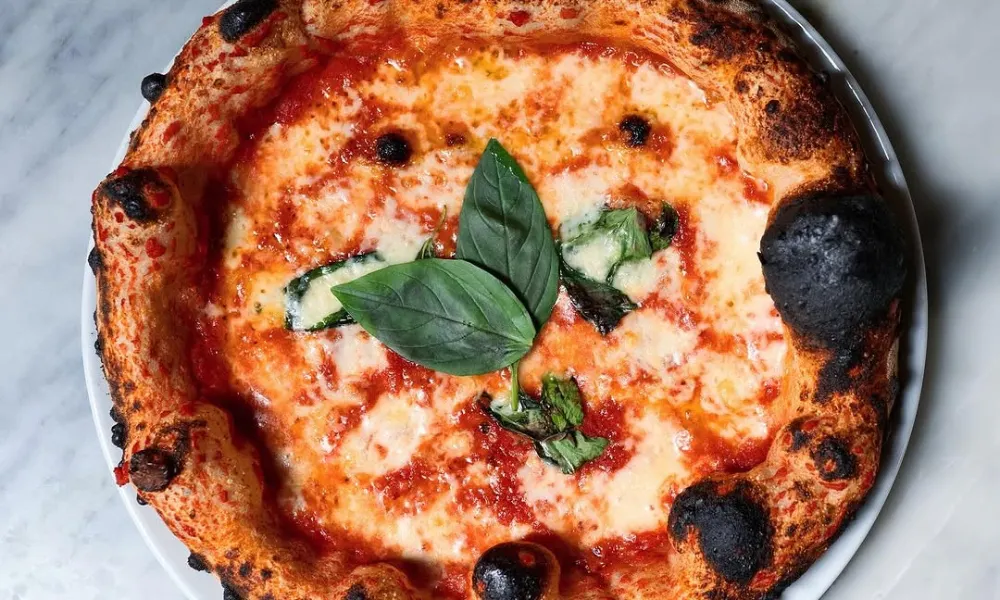 Margherita pizza with large crispy crust