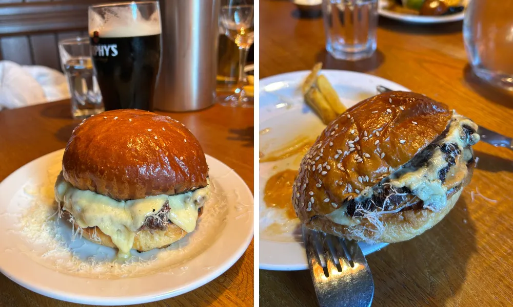 big burger with lots of cheese and a pint of murphy's