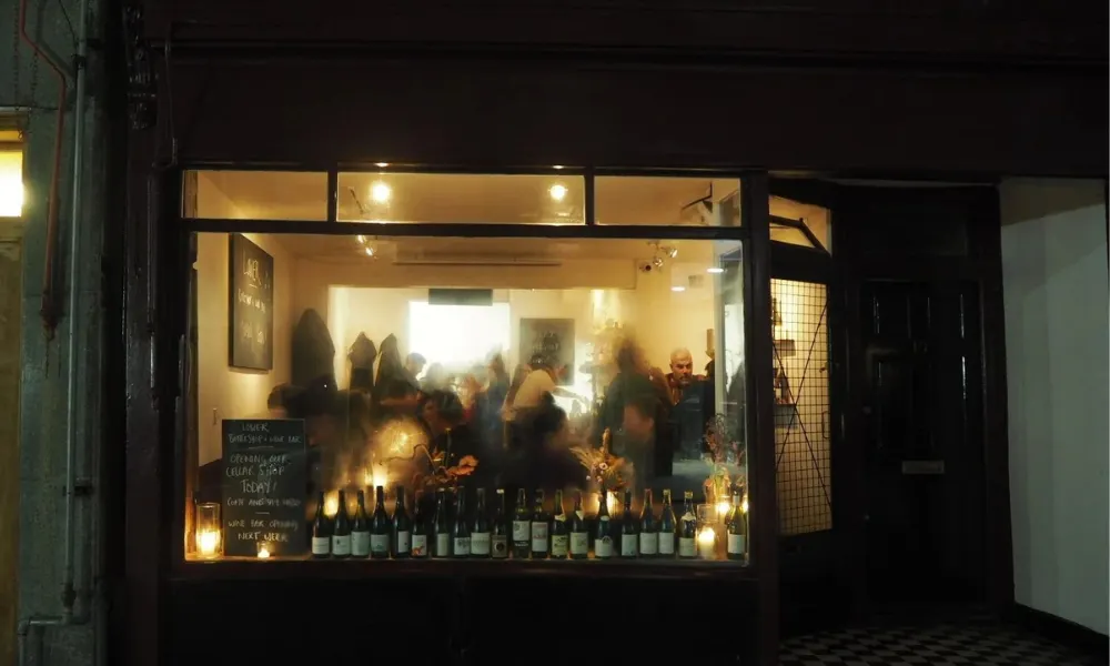 moody wine bar viewed from outside at night