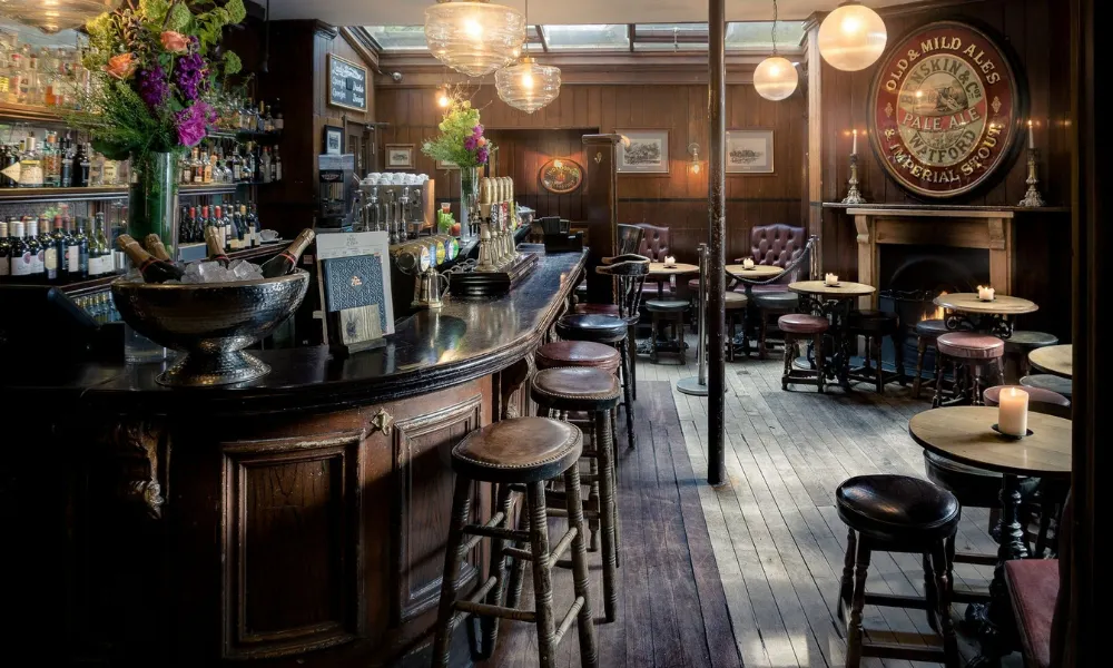 Pub bar and interior with a fire visible in the background