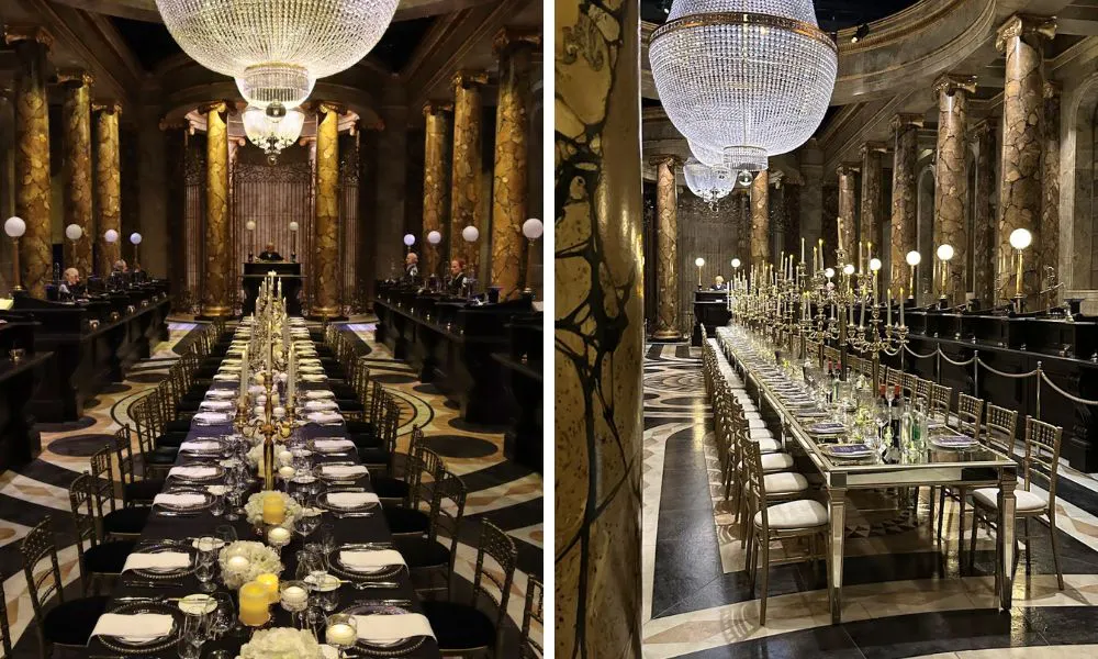 ornate bank hall with long table and chandelier