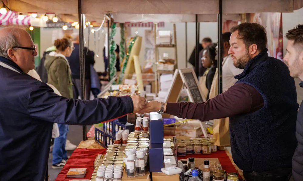 sale interaction at one of the market stalls