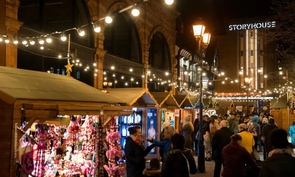 market huts with globe string lights and candy