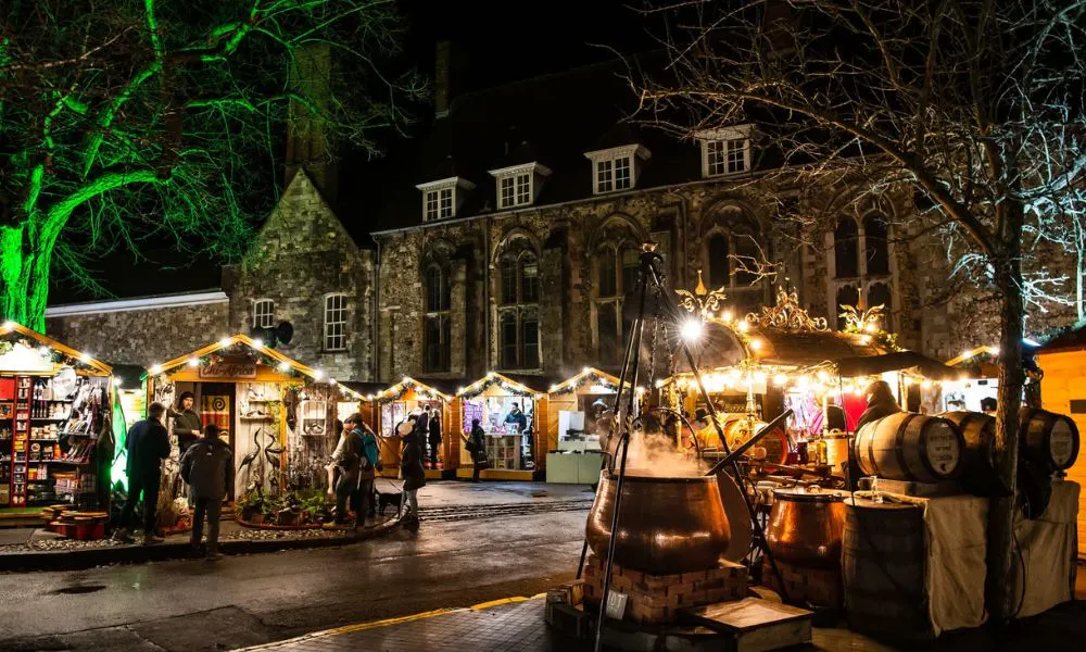 Christmas market with cauldron of mulled wine