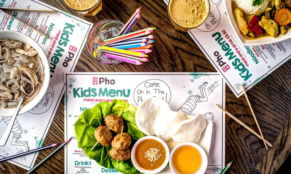 a children's menu with prawn crackers, dips and skewers