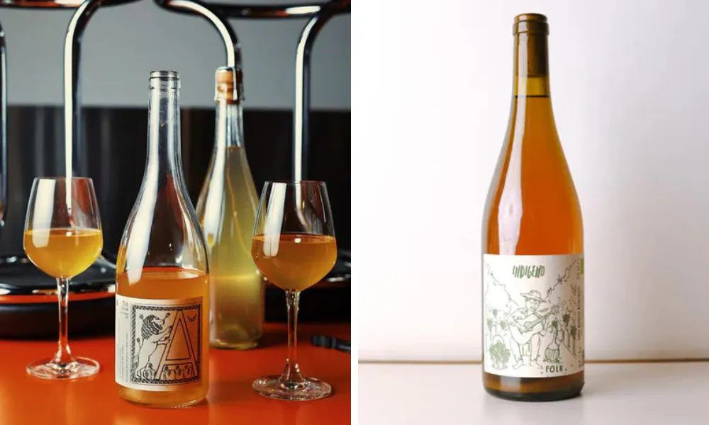 orange wine in two wine glasses and bottle of wine
