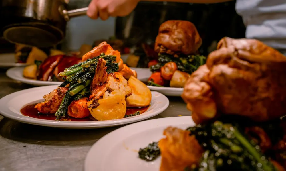 Plating up Sunday roasts at Evelyn's Manchester