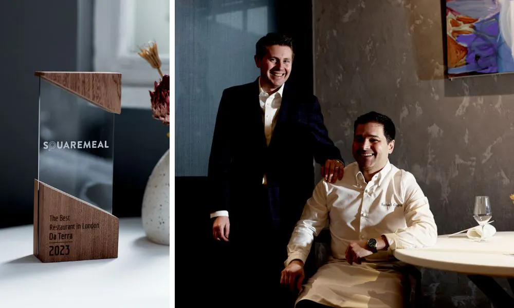 A picture of a wood and glass award beside a portrait of two men - one wearing chef's whites and the other in a suit