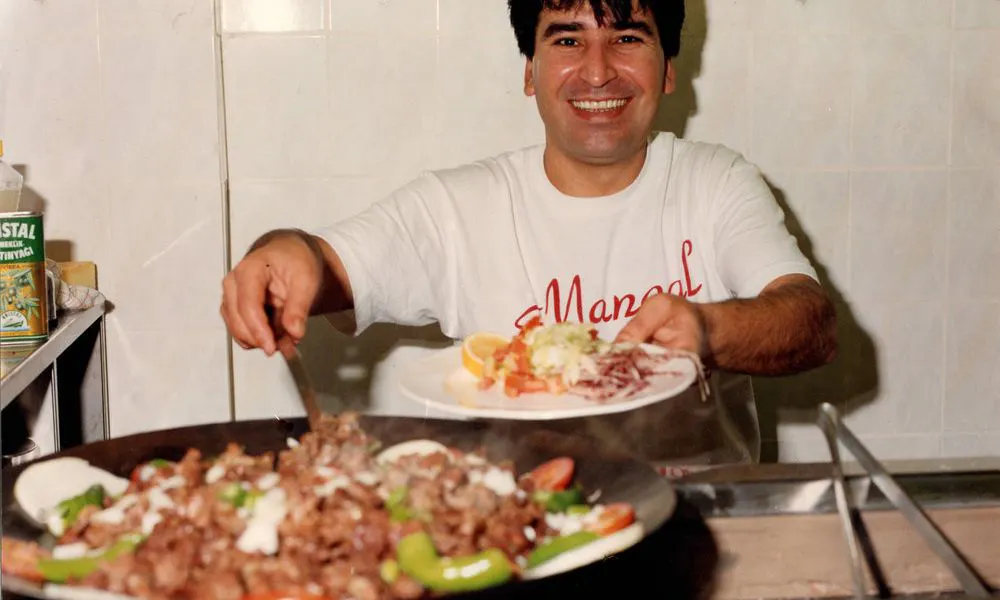Mangal II owner serving food