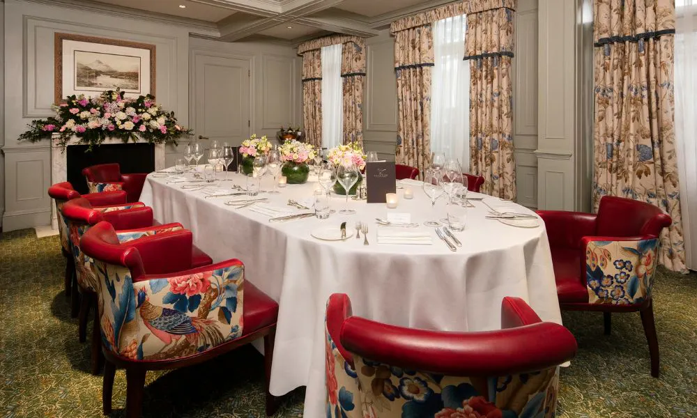elegant private dining rooms with white-clothed tables and floral chairs