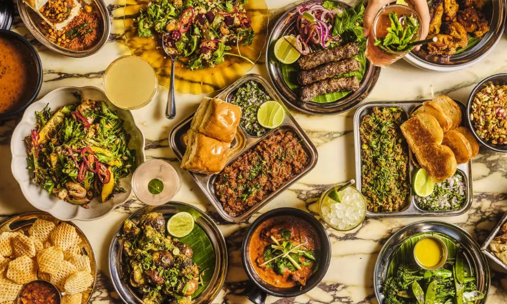 an aerial shot of a selection of Indian dishes on a table