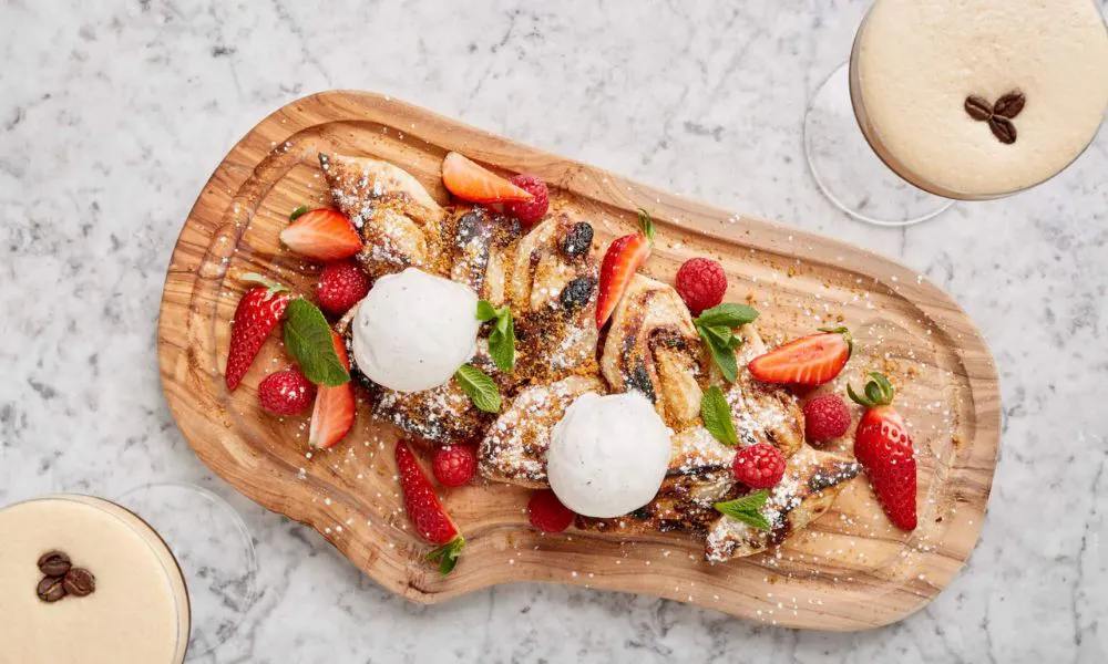 Dessert with strawberries on a wooden board