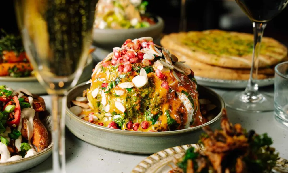 whole roasted cauliflower with sauce and dressing