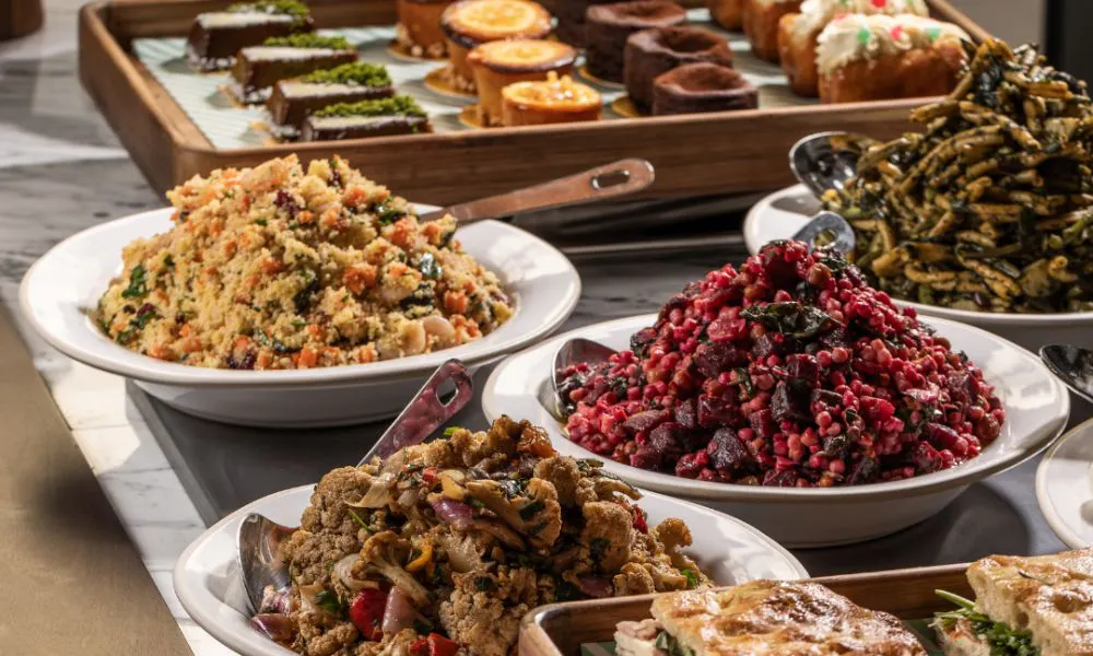 buffet style bowls of salads and sweets