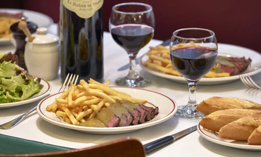 Steak frites and red wine at Le Relais de Venise