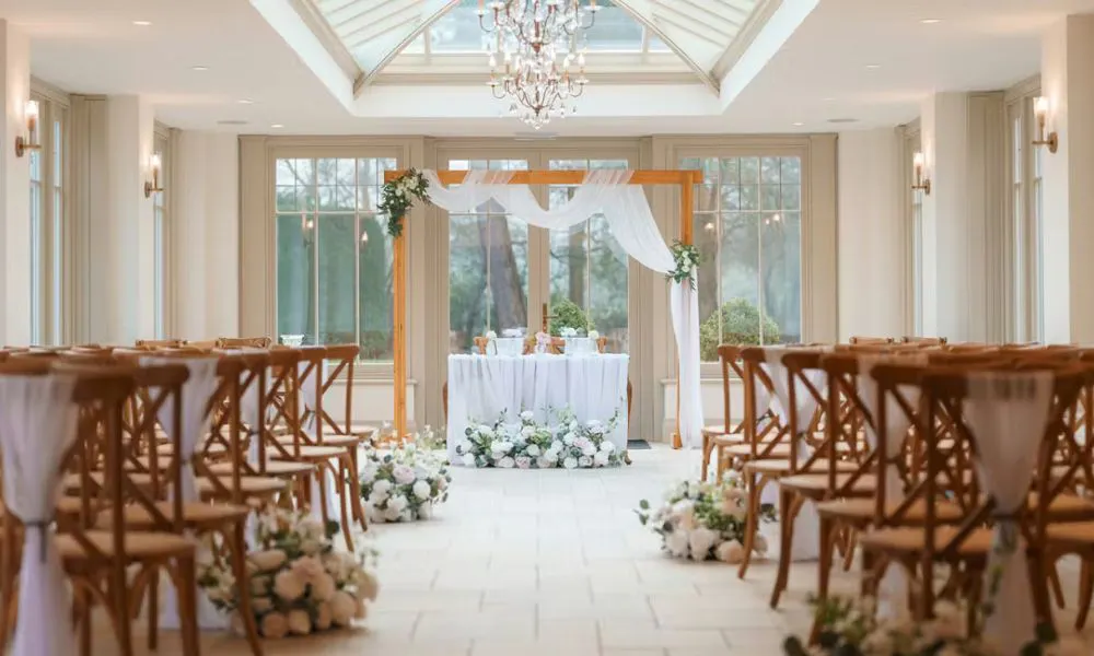 idyllic orangery set up for a wedding ceremony