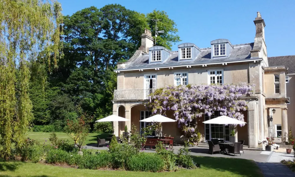 small country house wedding venue with wisteria