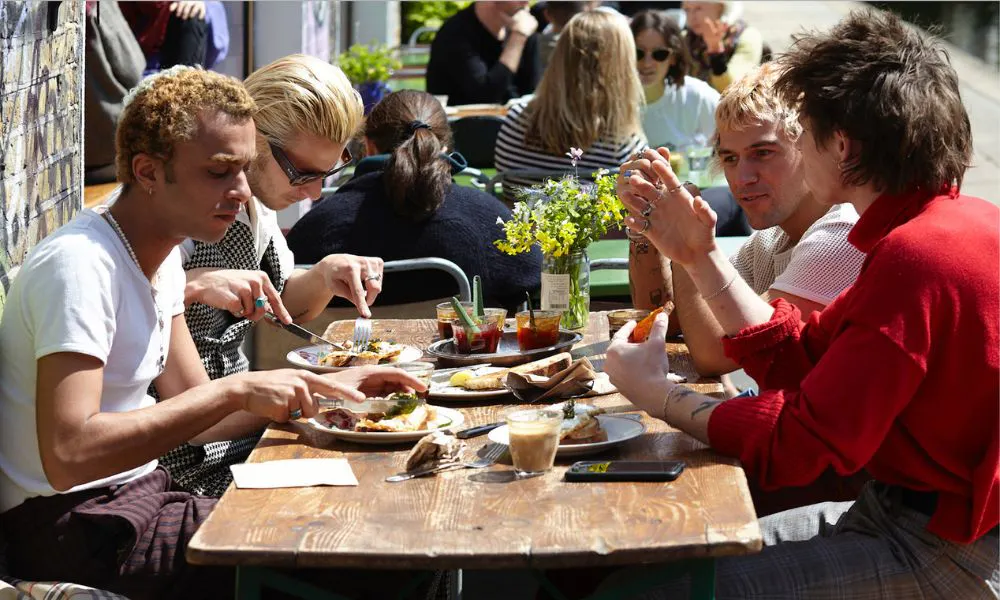 people dining outside by the canal