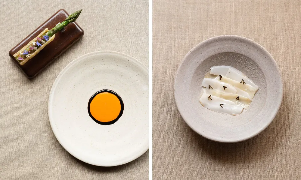 asparagus with an orange circle of sauce