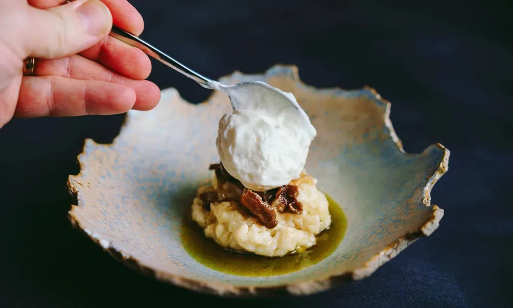 bowl with rough edges and dollop of cream
