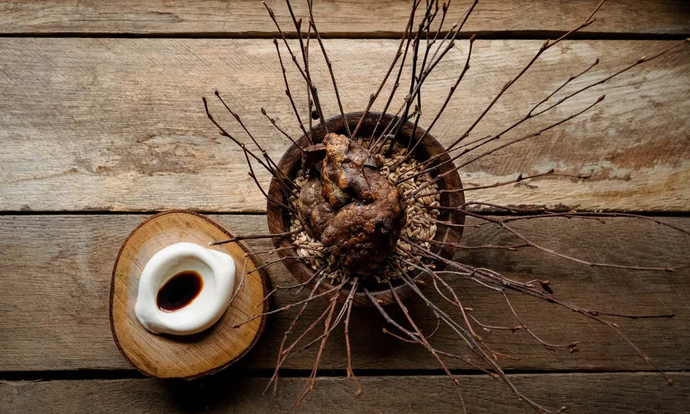 brown food item with long twigs beneath it