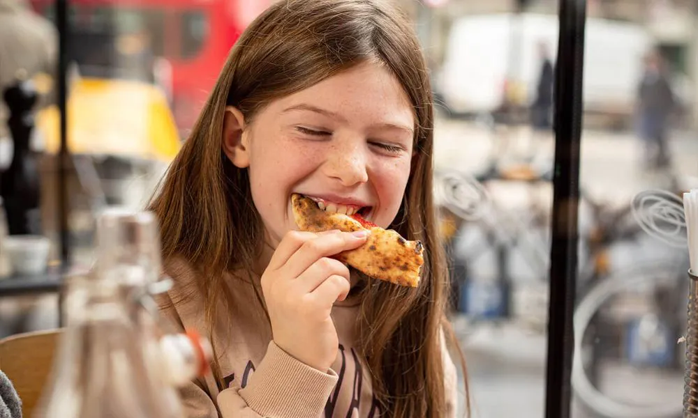 Girl eating pizza