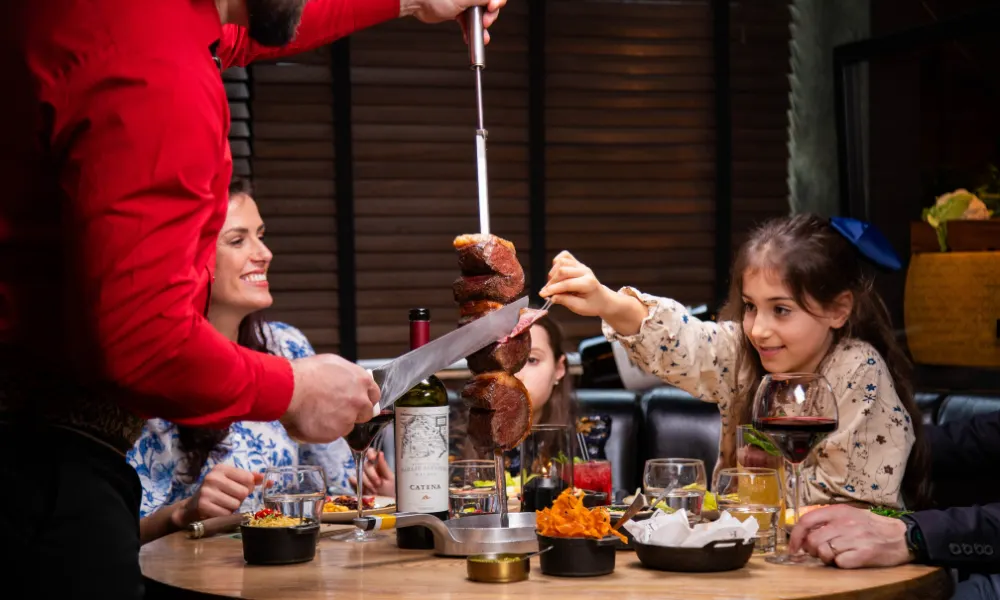 Mother and daughter eating at fazenda
