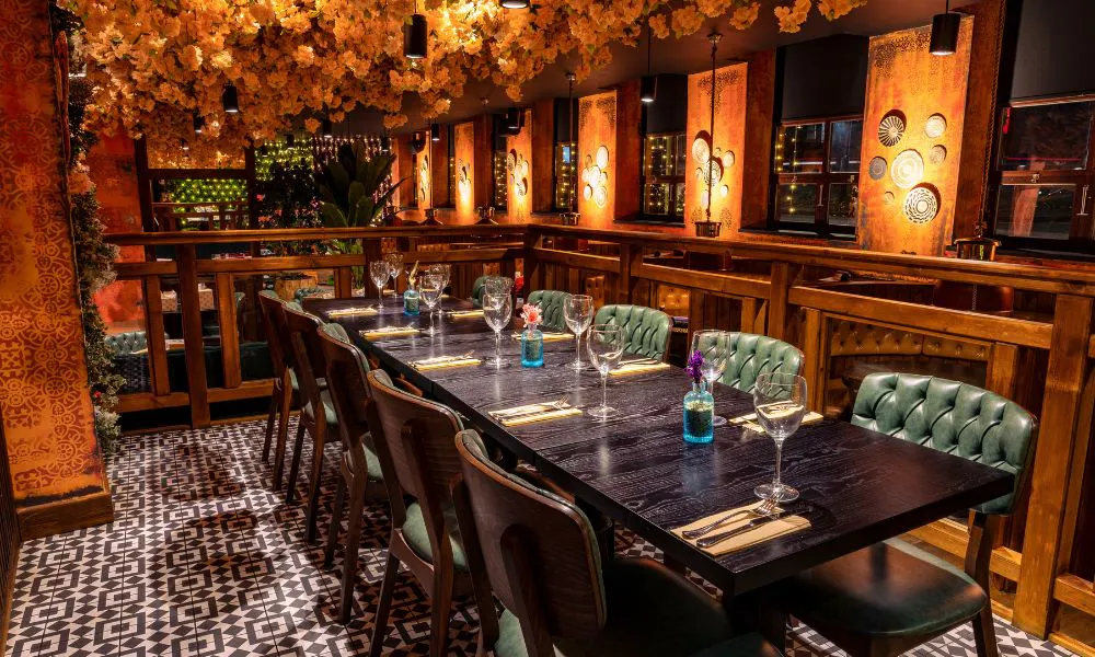 sleek private dining room with floral ceiling installation